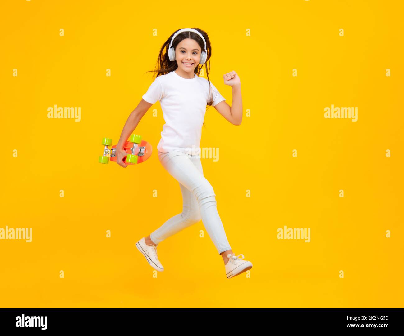 Studio shot of trendy teenage fashion model in casual look. Teenager youth hipster urban lifestyle. Child girl in street style in hipster clothes with Stock Photo