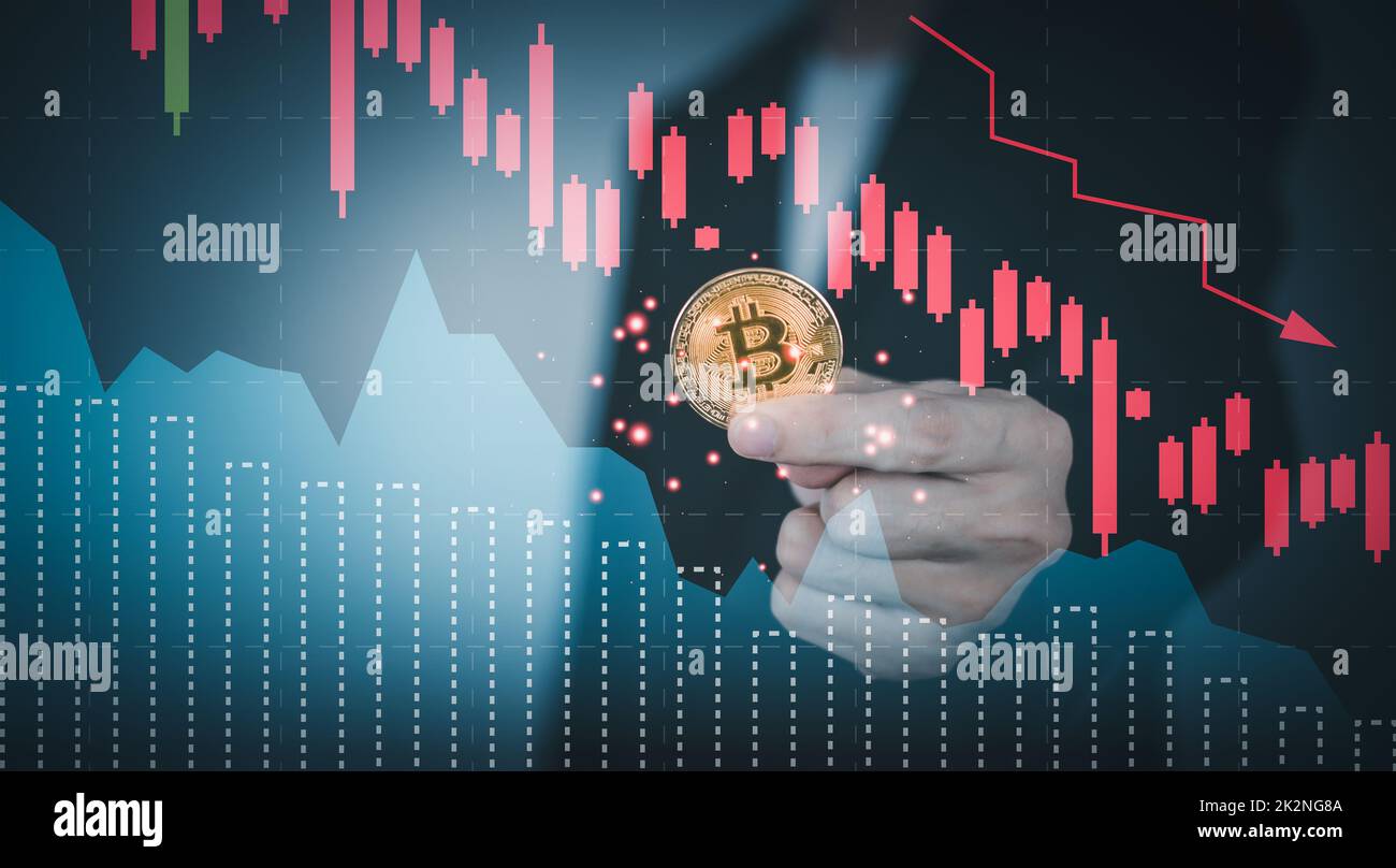 Bitcoin price crash falling down with graph. Man hand holding
