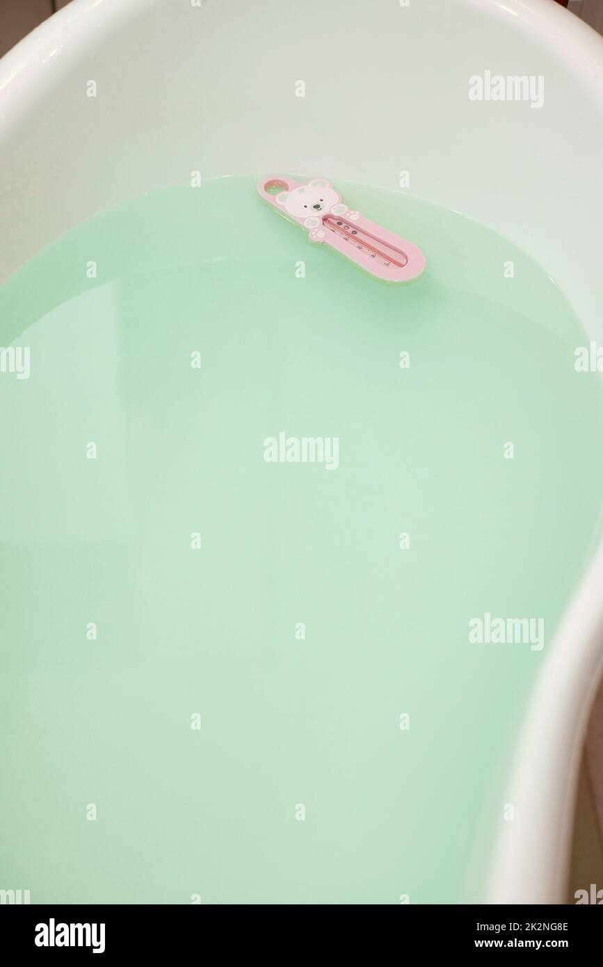 white plastic baby bath with warm water Stock Photo Alamy