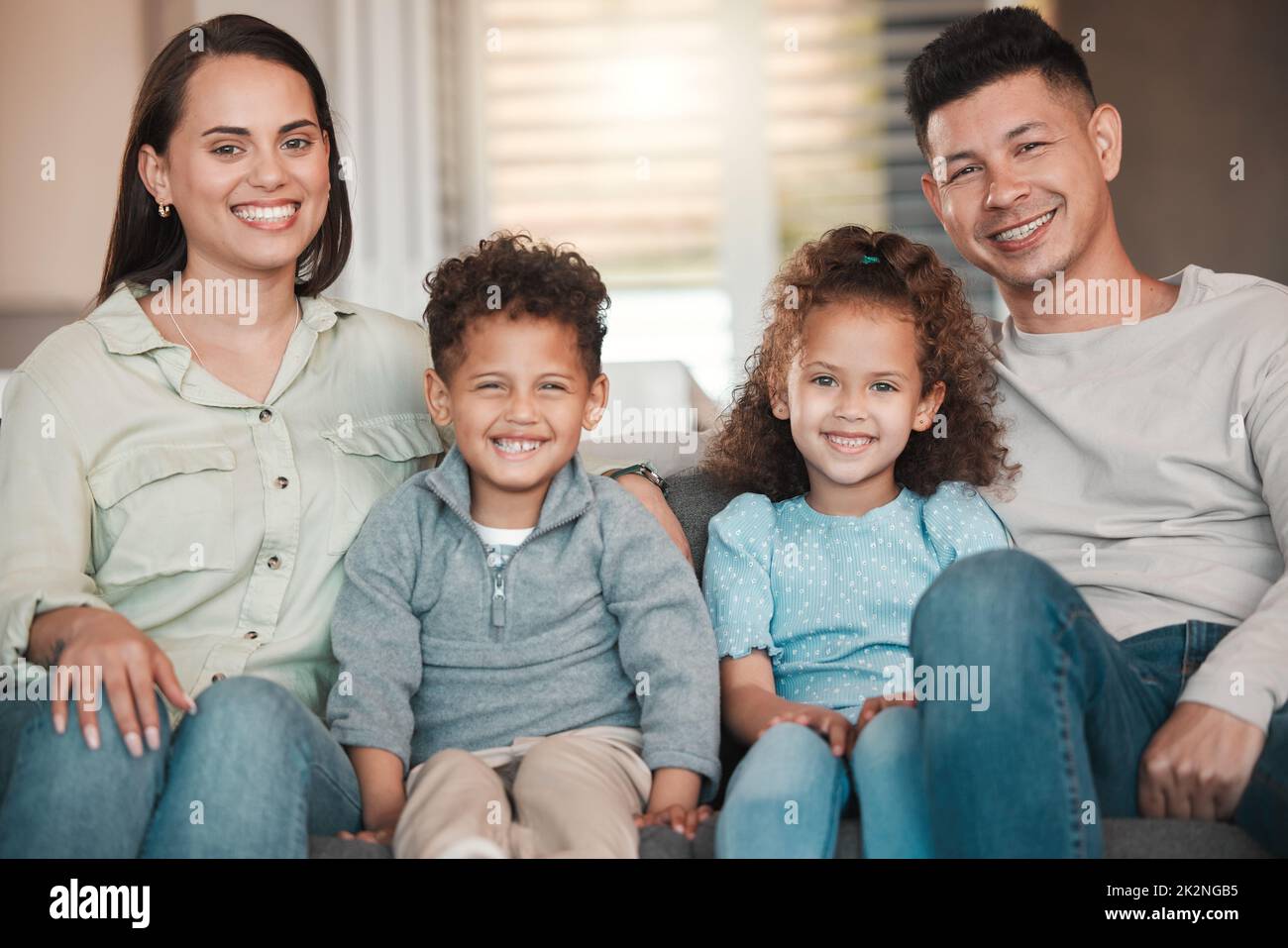 So much happiness. Shot of a young family spending time together at home. Stock Photo