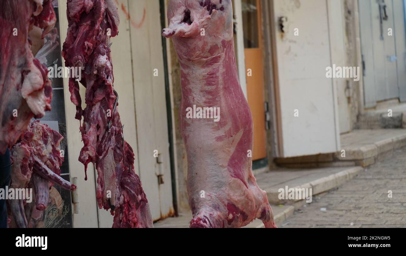 Raw meat exposed in a street market for sale in Nazareth, Israel Stock Photo