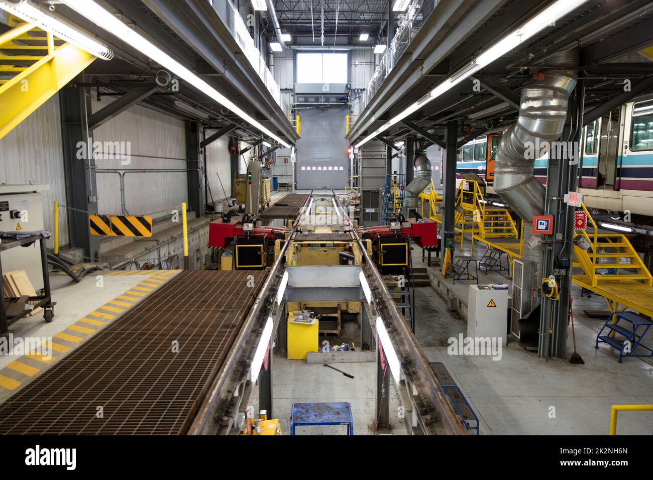 Equipment and rails in transit maintenance facility Stock Photo Alamy