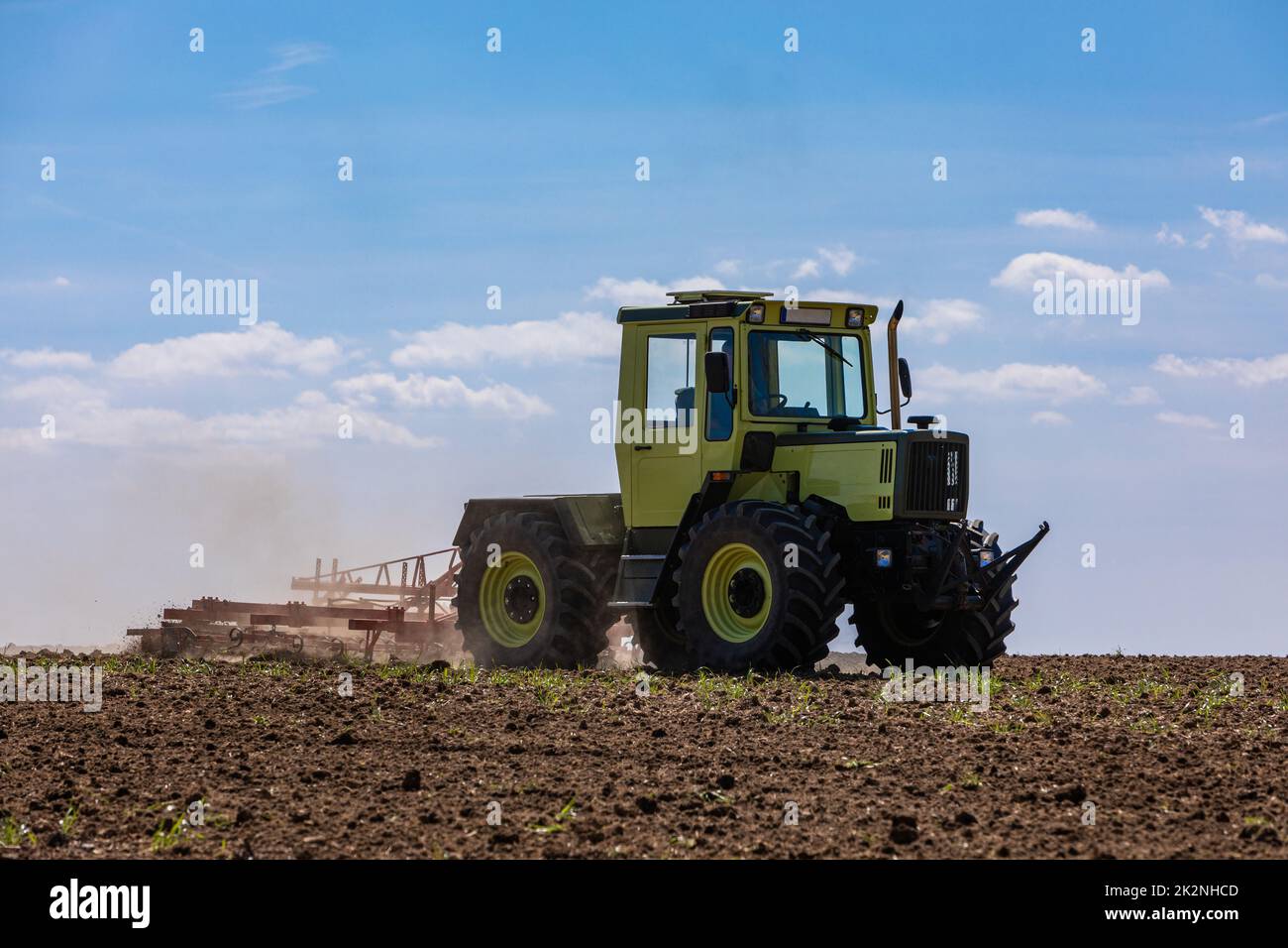 detail of a tractor preparing the field with machinery Stock Photo