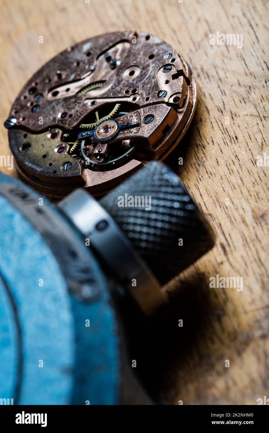 closeup of pocket watch mechanism and clockworks on the table of a