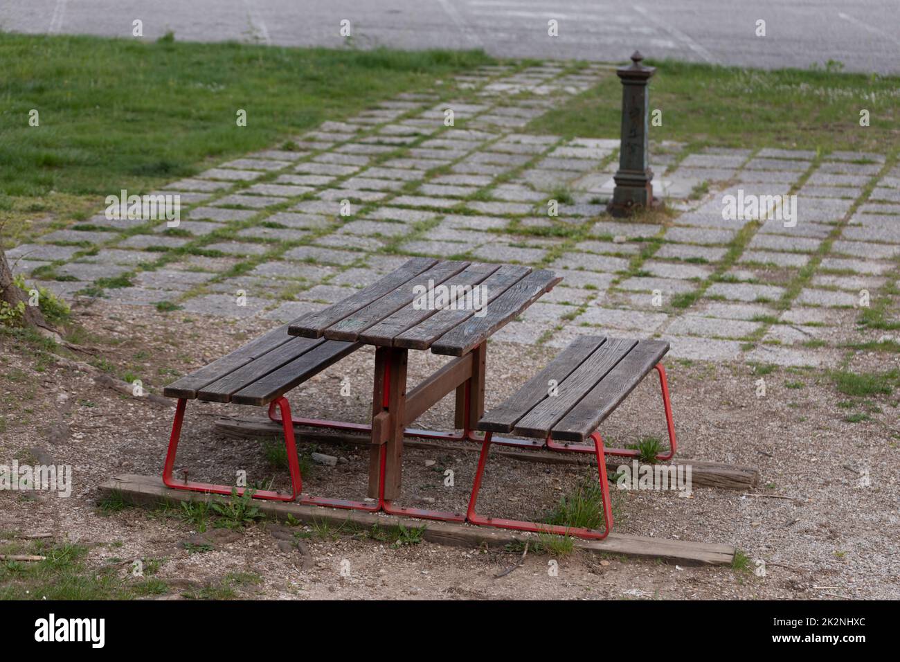 Vacant rustic bench and table in a deserted park Stock Photo