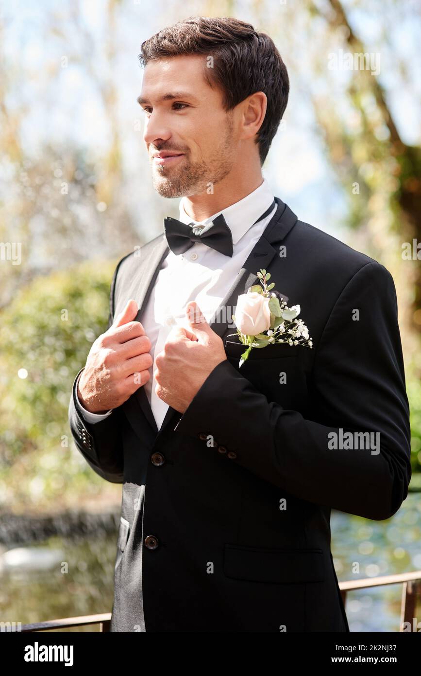 Marriage life here I come. Shot of a handsome young man fixing himself ...