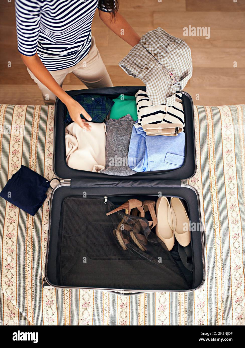 Cropped Shot Of Woman Packing Suitcase For Free Stock Photo and