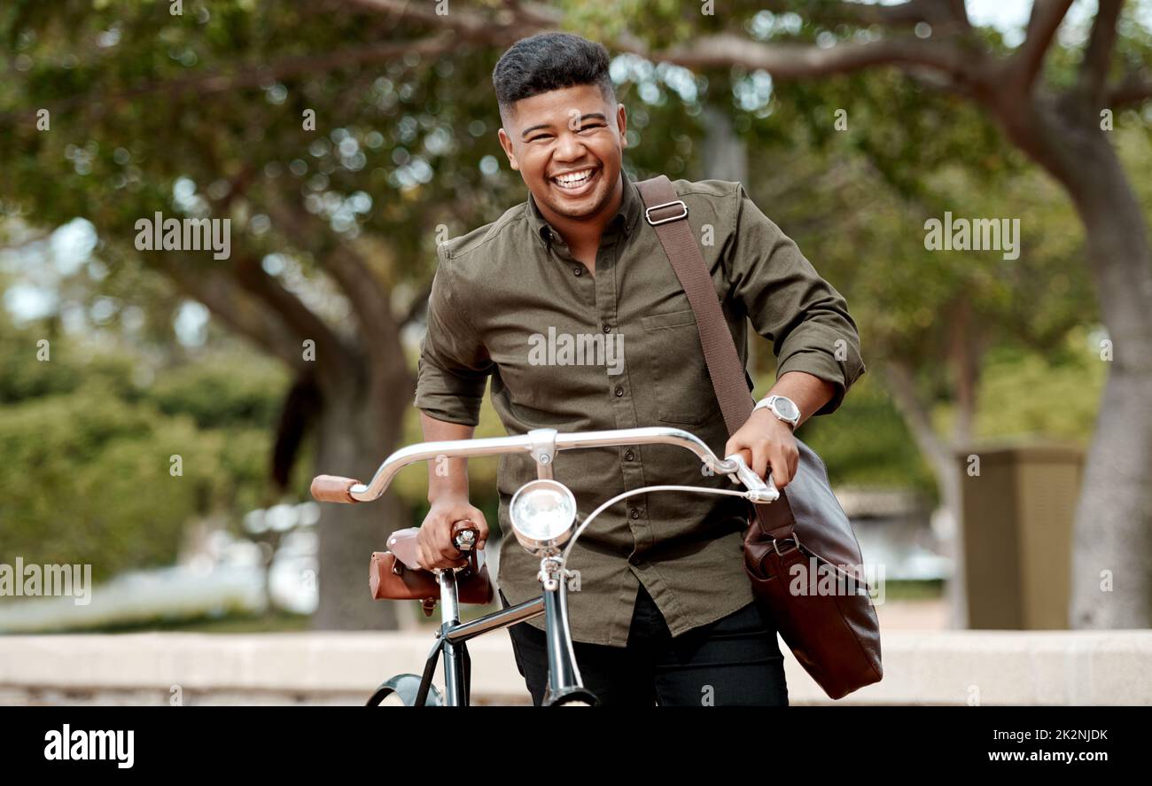 Sustainability starts with you. Shot of a young businessman riding a bicycle in the city. Stock Photo