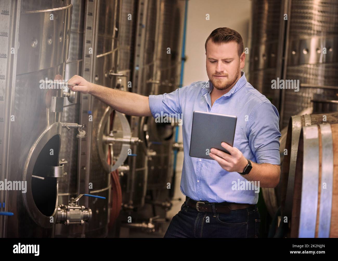 If you dont have a solution, find one online. Shot of a male sommelier using his digital tablet at work. Stock Photo