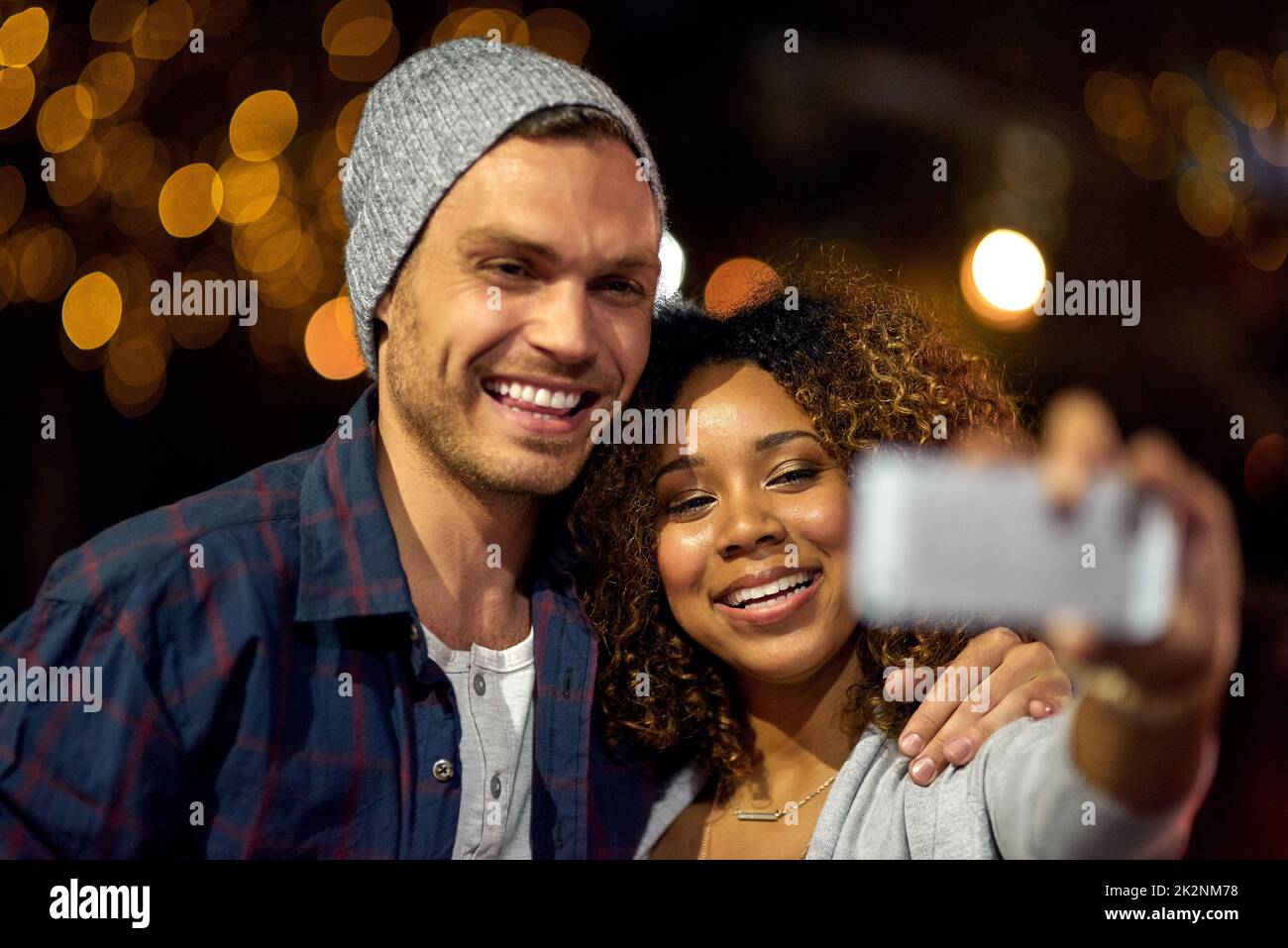 Well always remember this night. Cropped shot of a young couple out on a date in the city. Stock Photo