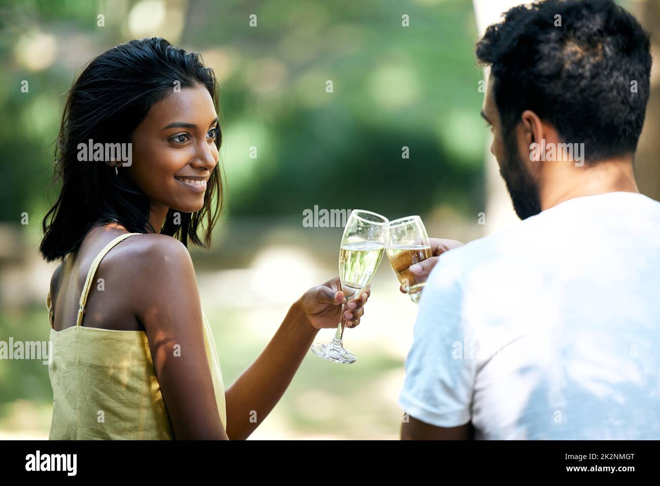 Love is something that should be celebrated. Shot of a young couple making a toast while out on