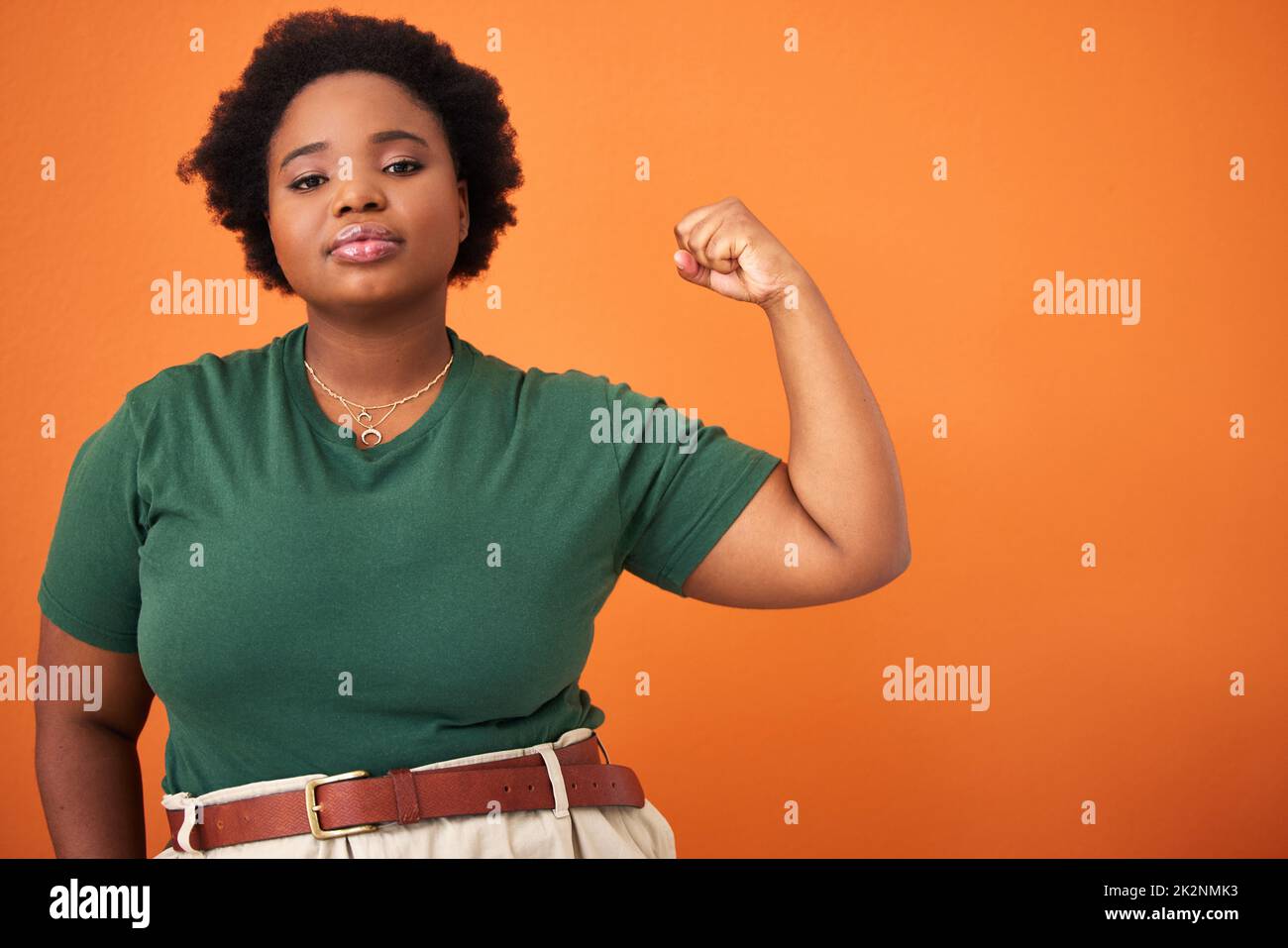 My strength comes from within. Shot of a beautiful young woman flexing