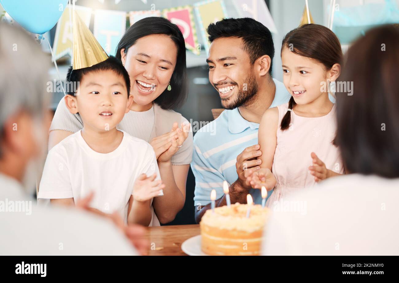 Each new birthday is a chance to begin again. Shot of a happy family celebrating a birthday at home. Stock Photo