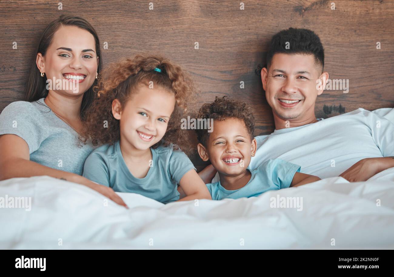 Smile a while. Shot of a young family spending time together at home. Stock Photo