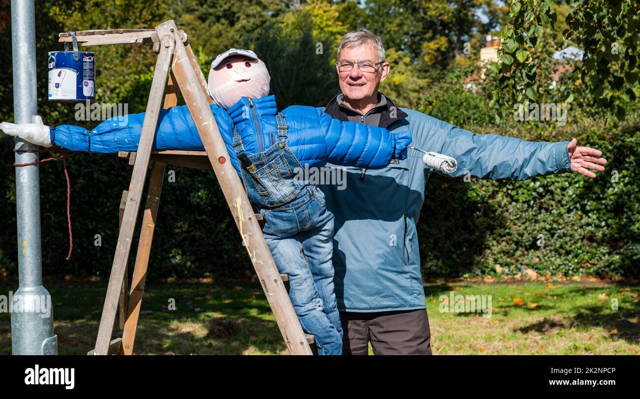 Dirleton, East Lothian, Scotland, UK, 23rd September 2022. Scarecrow Trail: the second trail this year has 18 scarecrows around the village. Pictured: a man with a fabulous scarecrow on the village green. Credit: Sally Anderson/Alamy Live News Stock Photo