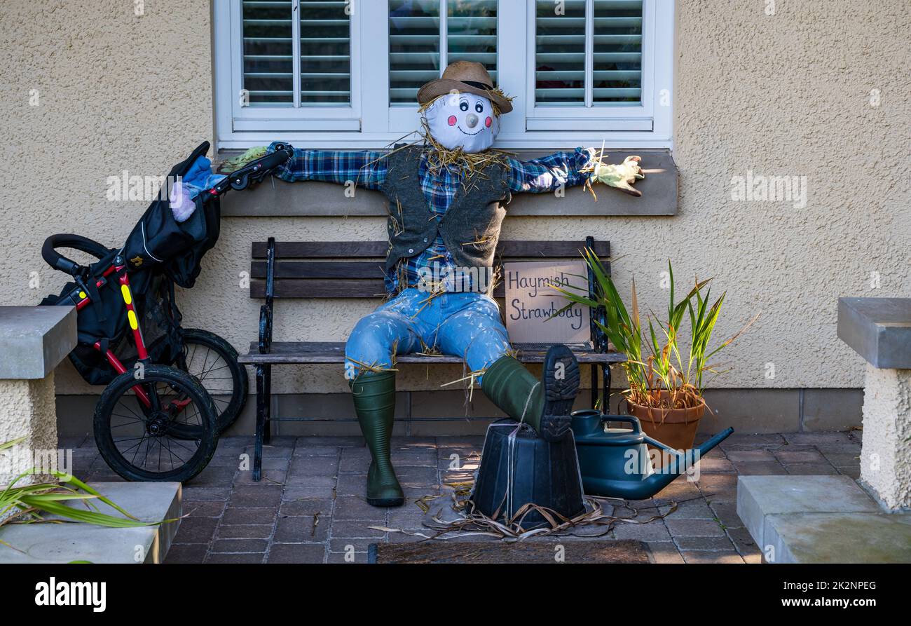 Dirleton, East Lothian, Scotland, UK, 23rd September 2022. Scarecrow Trail: the second trail this year has 18 scarecrows around the village. Pictured: a scarecrow outs de one of the houses in the village. Credit: Sally Anderson/Alamy Live News Stock Photo
