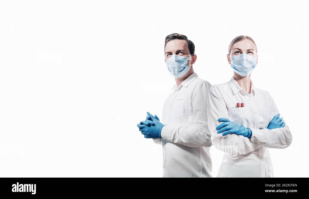doctors man and woman on a white background in medical masks on the face Stock Photo