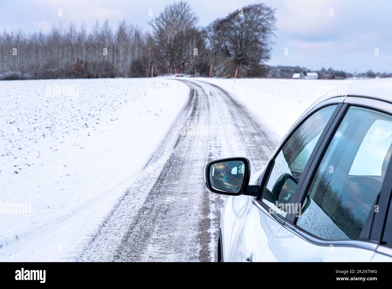 Winter road trip in Sweden by car. Car winter driving vacation in the Scandinavian cold lands. Nordic driving holiday on a frozen trail or path Stock Photo