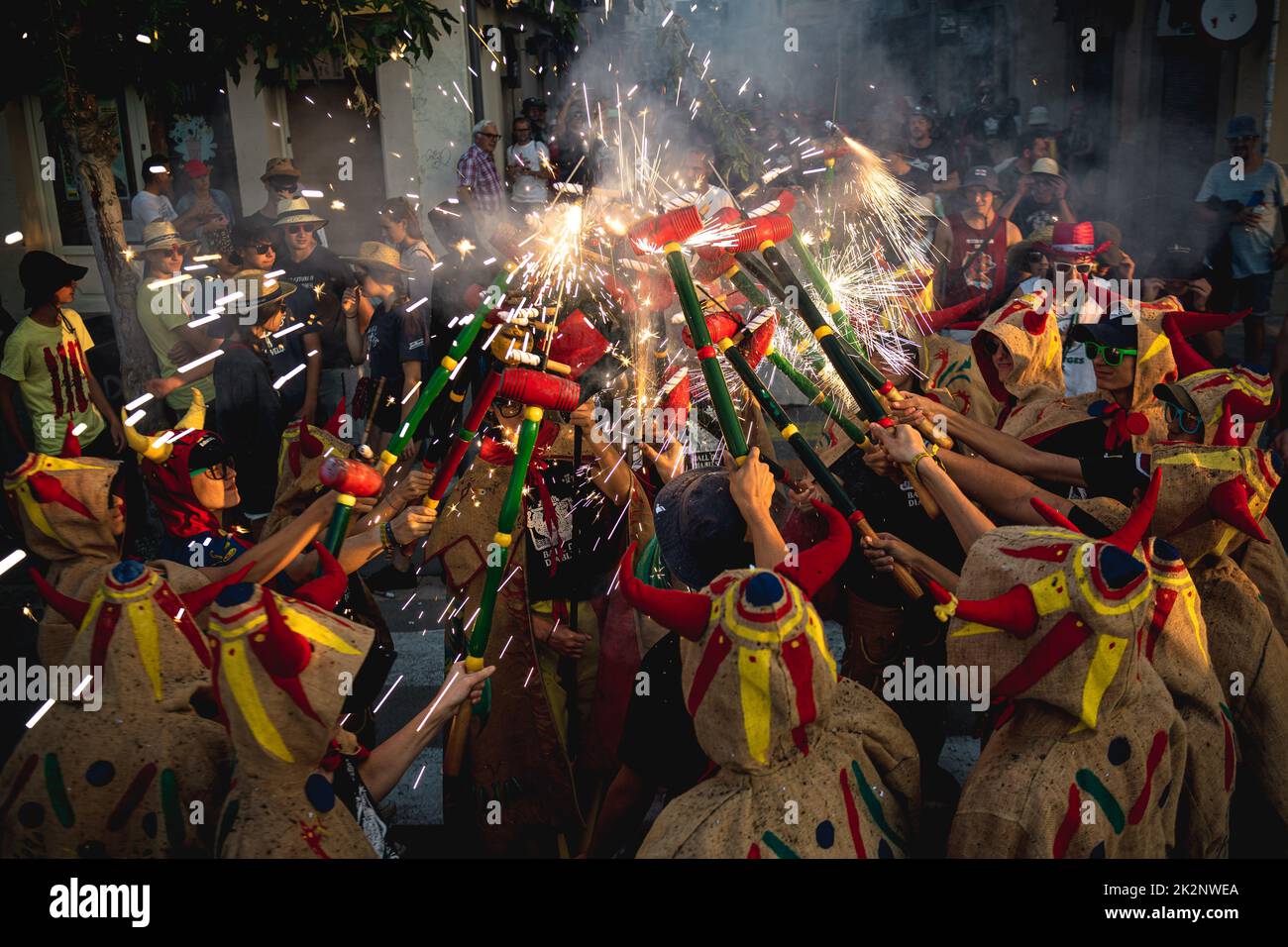 Sitges, Spain. 23rd Sep, 2022. Little devils gather to enlighten their stick mounted fire crackers during the traditional morning children 'correfoc' during Sitges' Santa Tecla Festival Credit: Matthias Oesterle/Alamy Live News Stock Photo