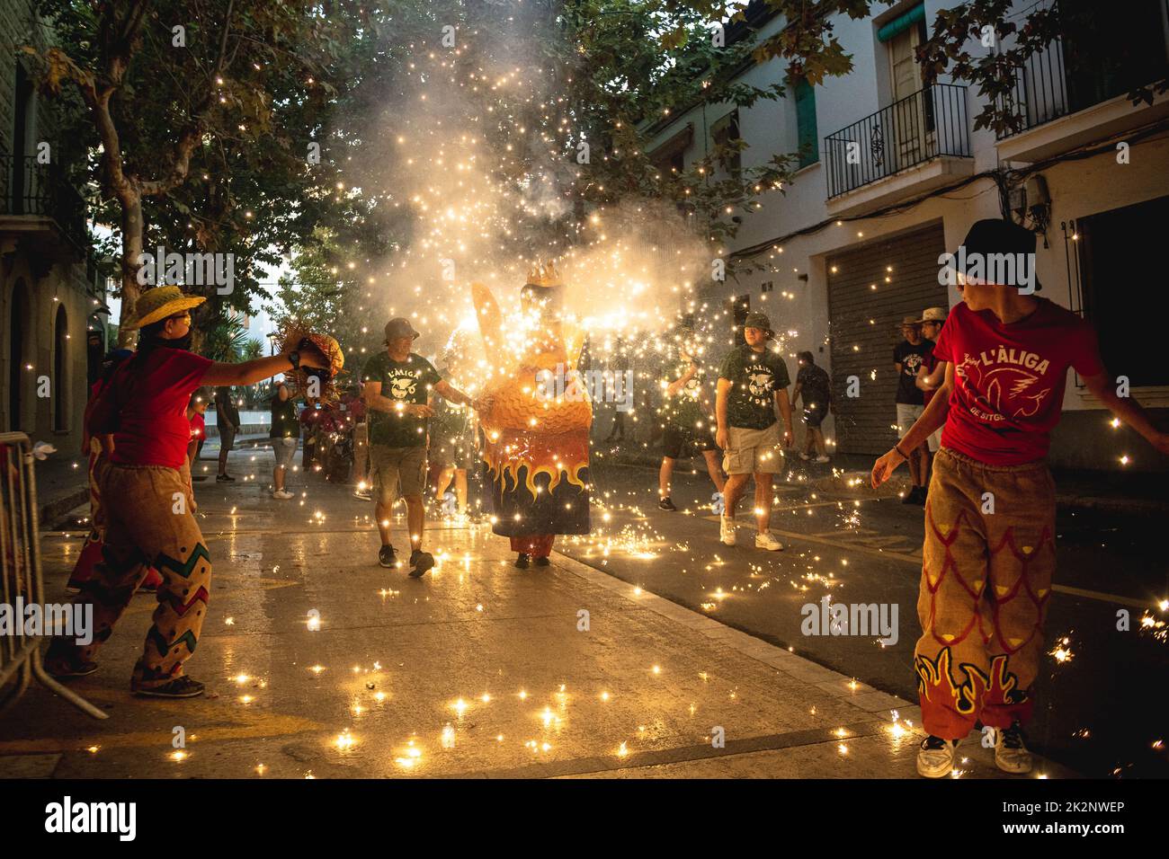 Sitges, Spain. 23rd Sep, 2022. A fire beast sets off his fireworks during the morning children 'correfoc' during Sitges' Santa Tecla Festival Credit: Matthias Oesterle/Alamy Live News Stock Photo