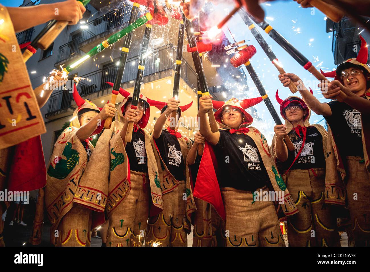 Sitges, Spain. 23rd Sep, 2022. Little devils gather to enlighten their stick mounted fire crackers during the traditional morning children 'correfoc' during Sitges' Santa Tecla Festival Credit: Matthias Oesterle/Alamy Live News Stock Photo