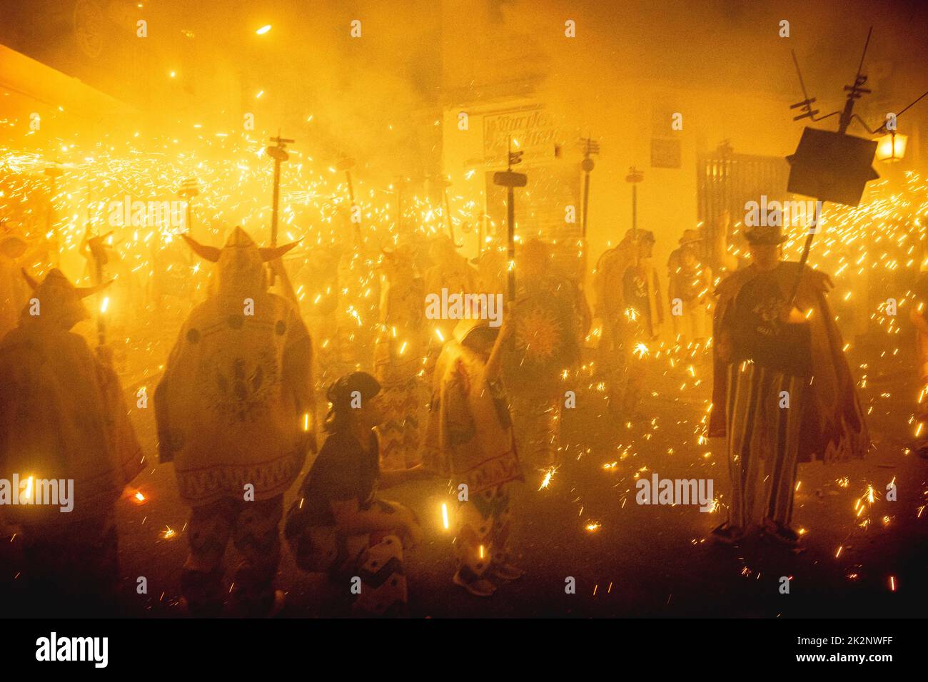 Sitges, Spain. 23rd Sep, 2022. The crowd dance under sparks during the morning children 'correfoc' during Sitges' Santa Tecla Festival Credit: Matthias Oesterle/Alamy Live News Stock Photo
