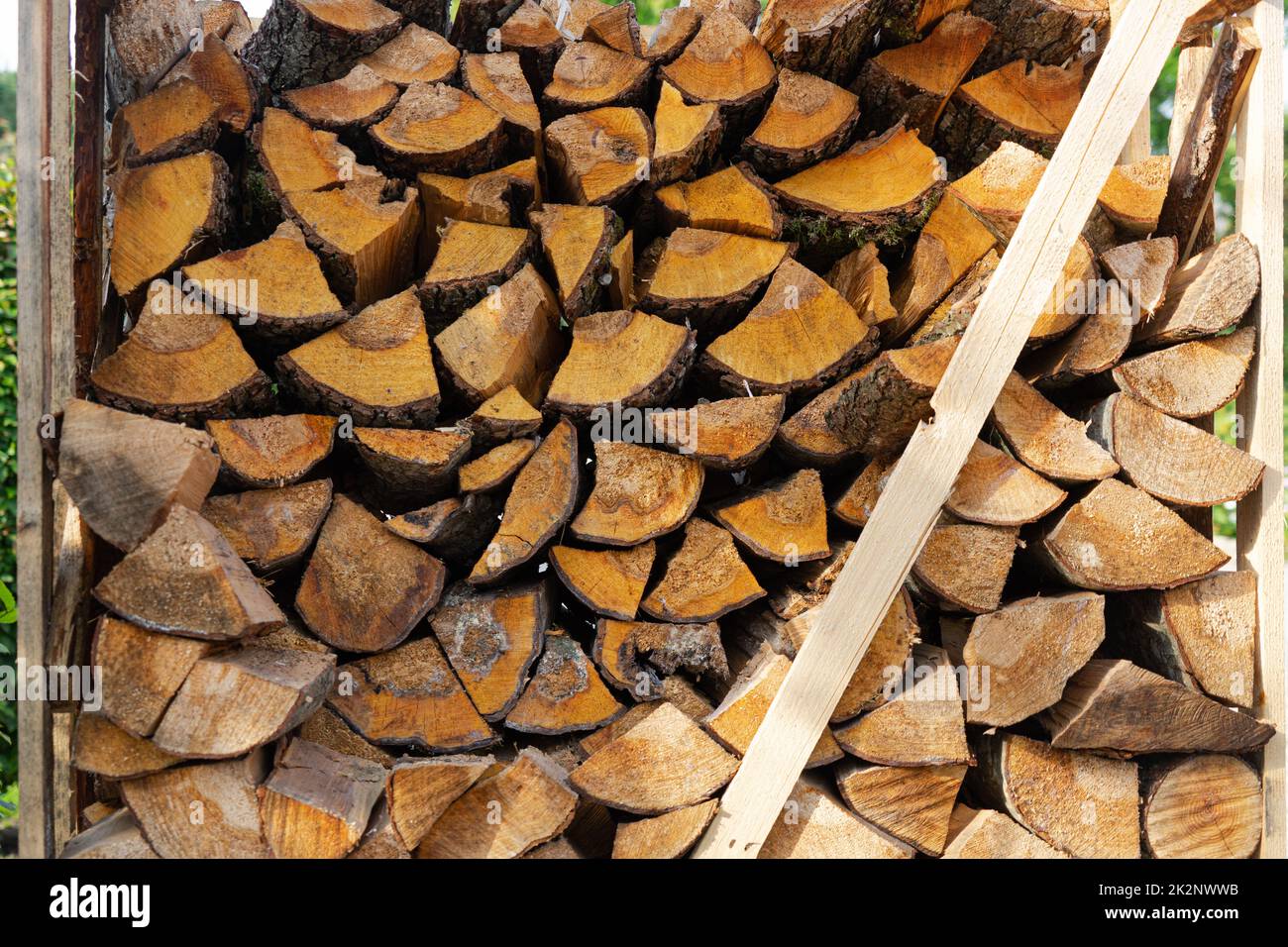Heating with wood: Building a winter stockpile of firewood Stock Photo