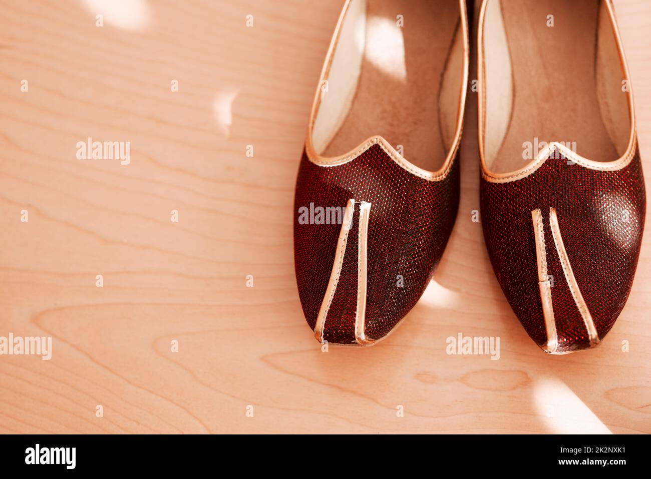 Style paired perfectly with culture. Shot of two formal mens shoes on the floor of a bedroom. Stock Photo