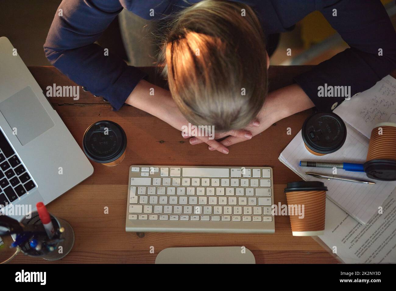 Is it time to go home yet. Shot of a tired young designer napping on