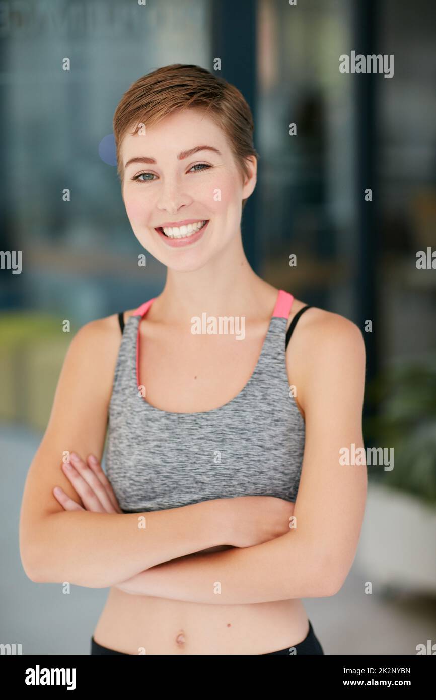 Happiness is good for your health. Portrait of a fit young woman in workout attire. Stock Photo