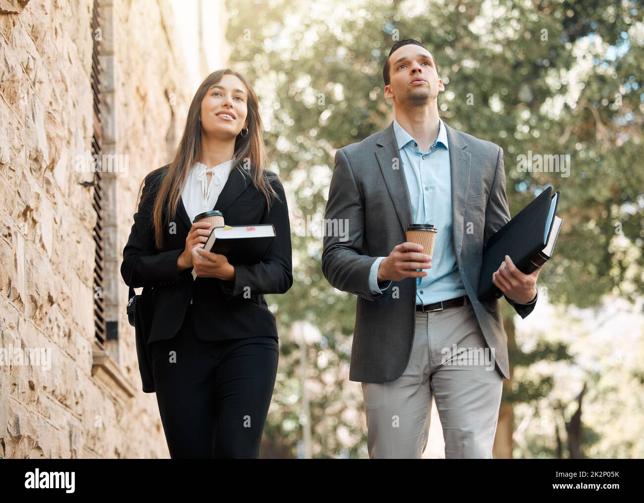 Every step brings you closer to justice. Shot of two business colleagues walking together in the city. Stock Photo