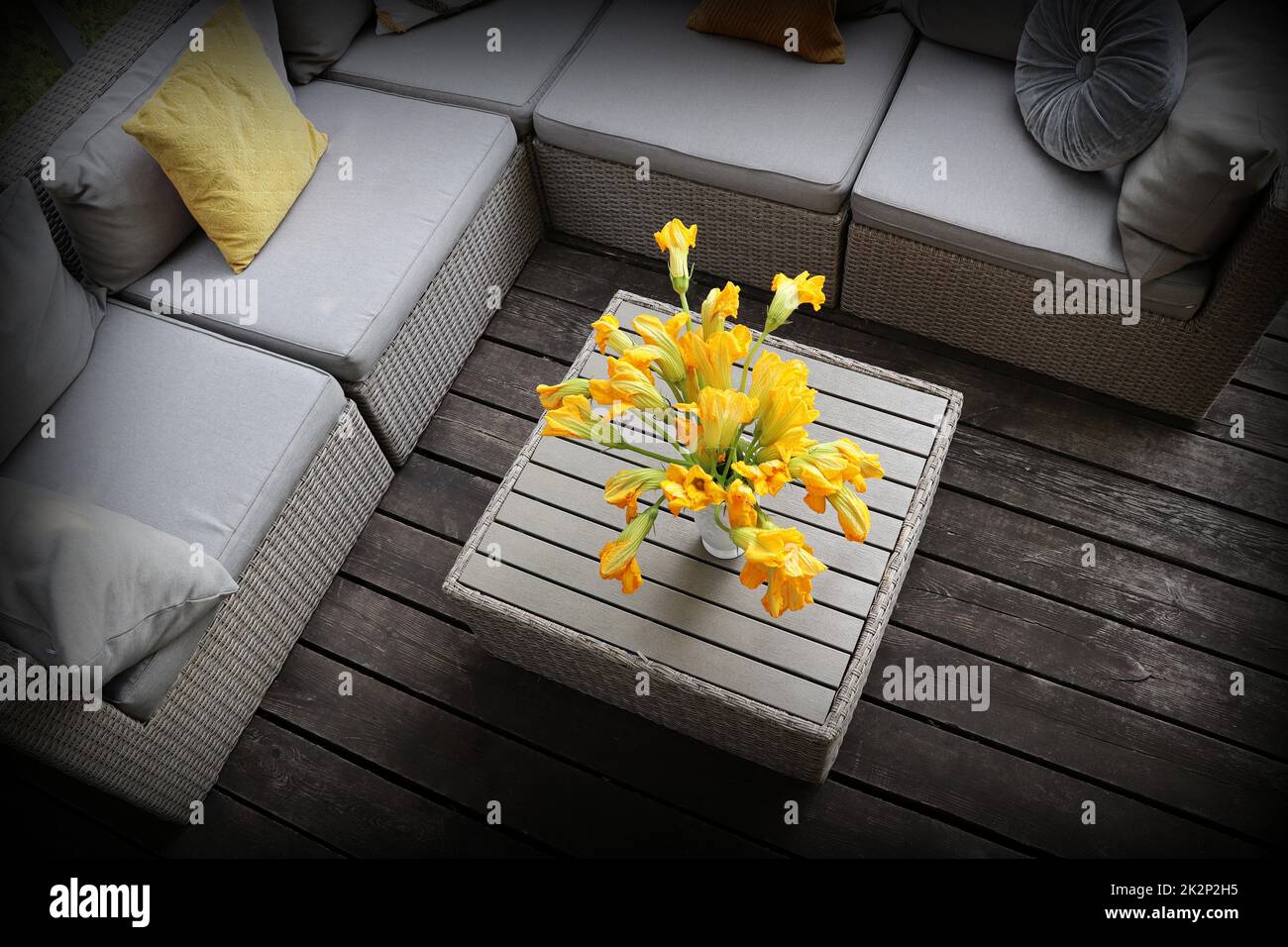 Outdoor furniture lounge group with chairs, sofa and table in a patio