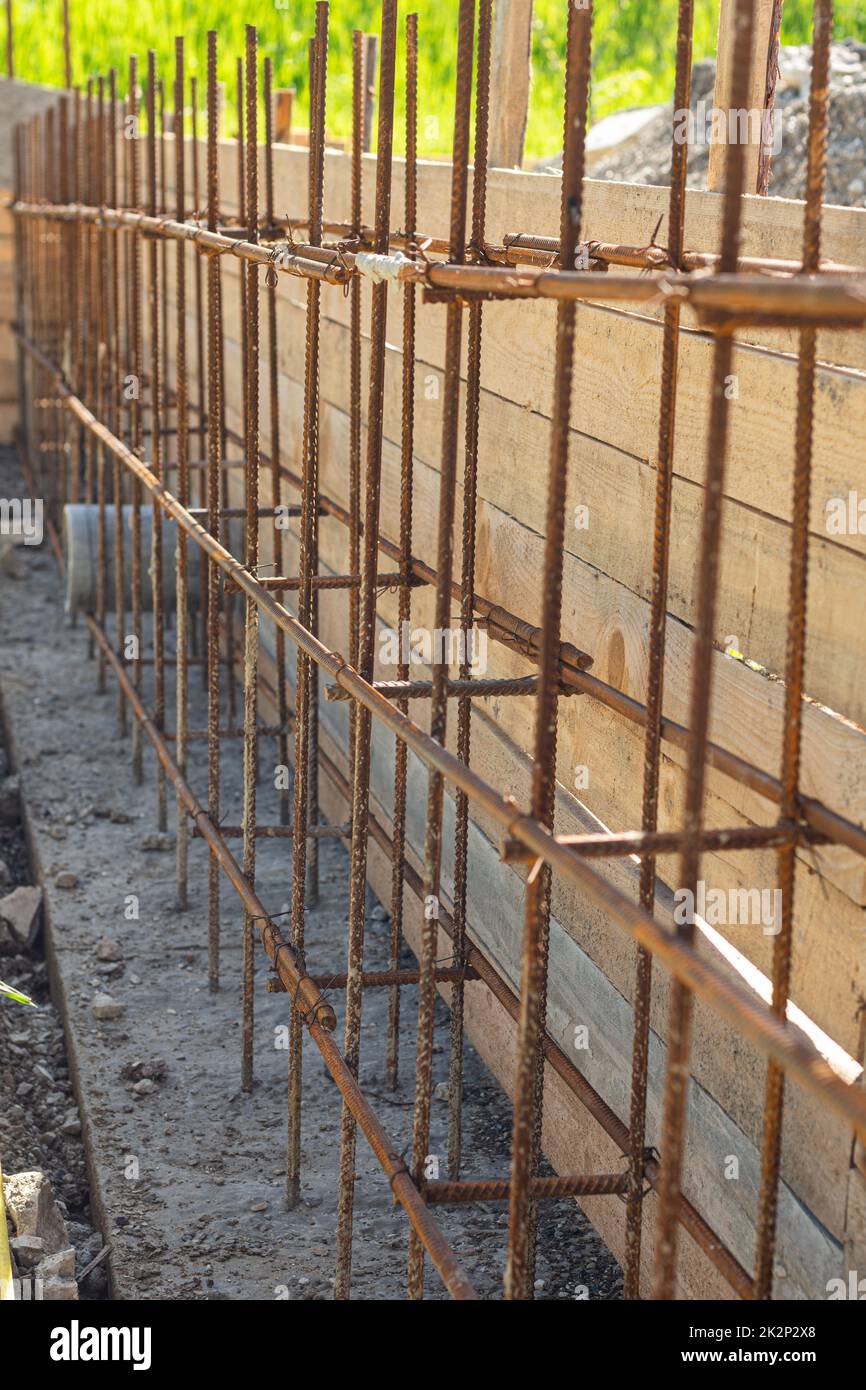 Construction of a strip foundation, reinforcement strapping, formwork