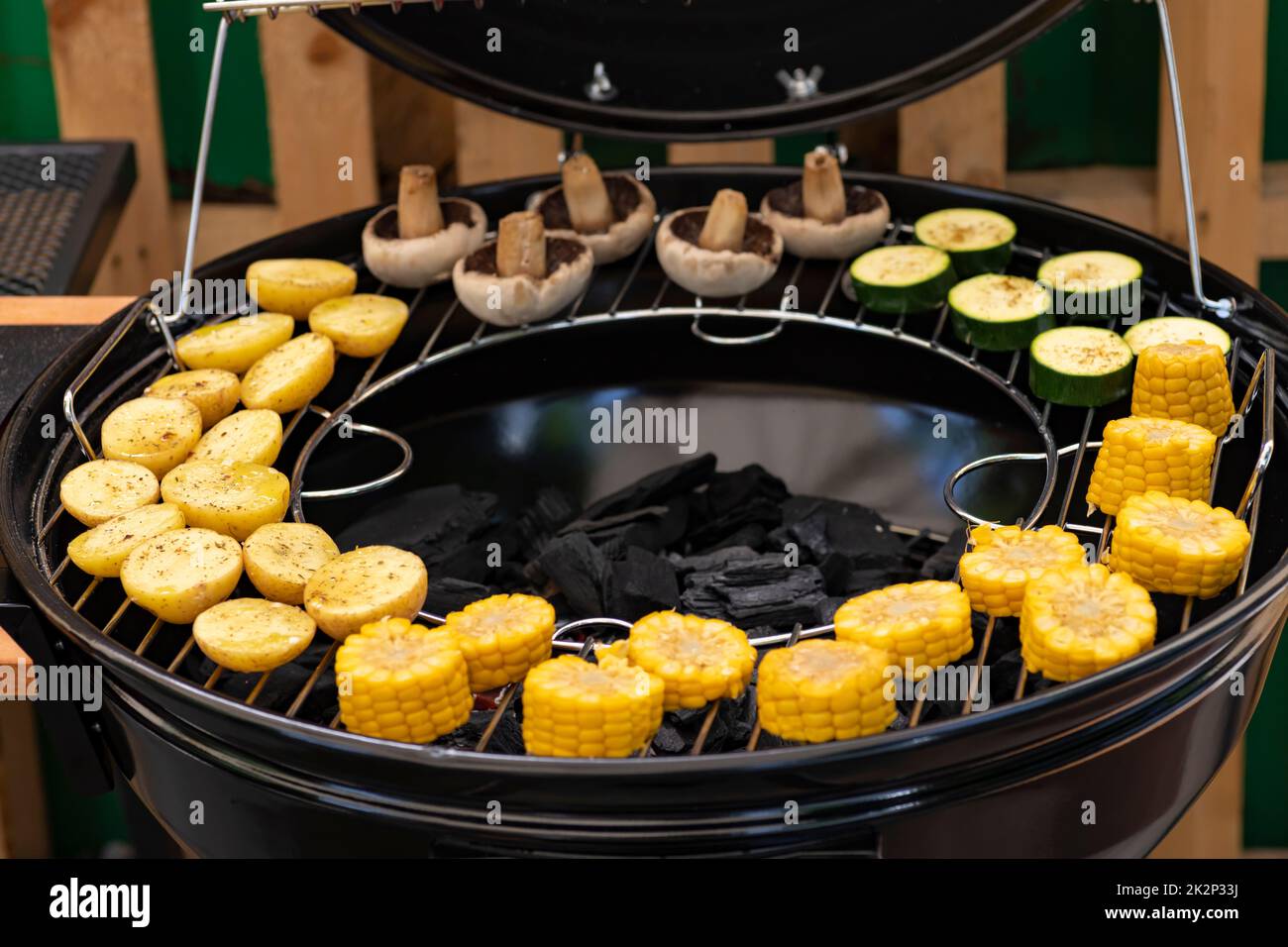 grill with potatoes, turkey meat, zucchini, mushrooms and sausages