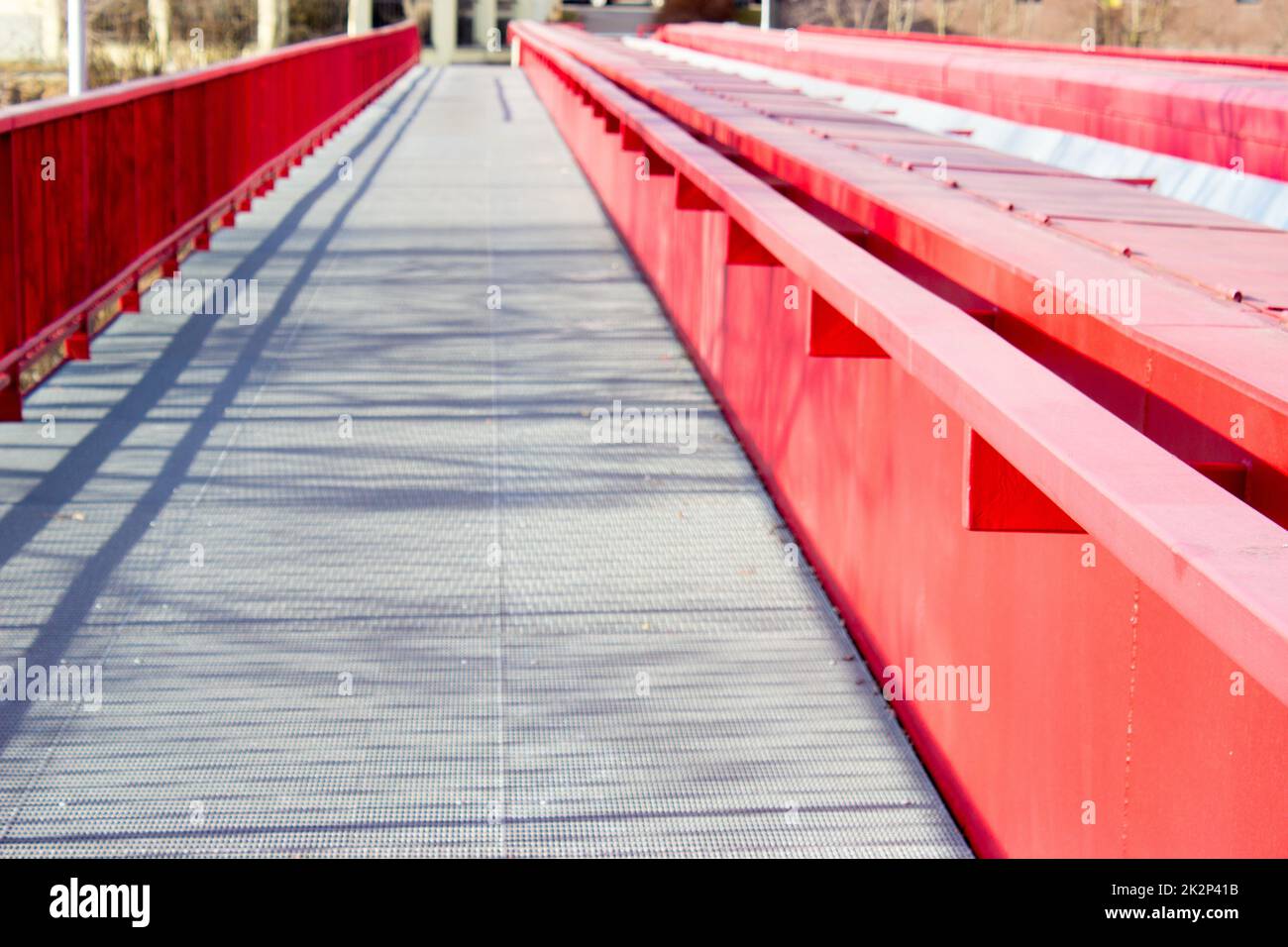Detail of metallic red bridge over railway Stock Photo