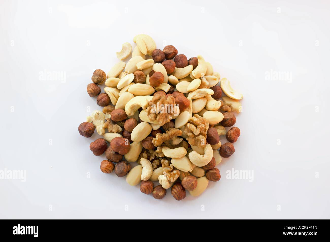 Mixture hazelnuts almonds walnuts cashews on pile Stock Photo
