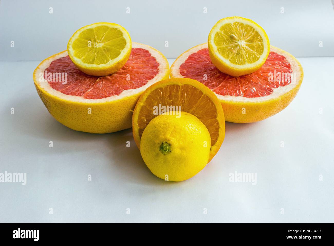 Citrus fruits being cut in half Stock Photo Alamy