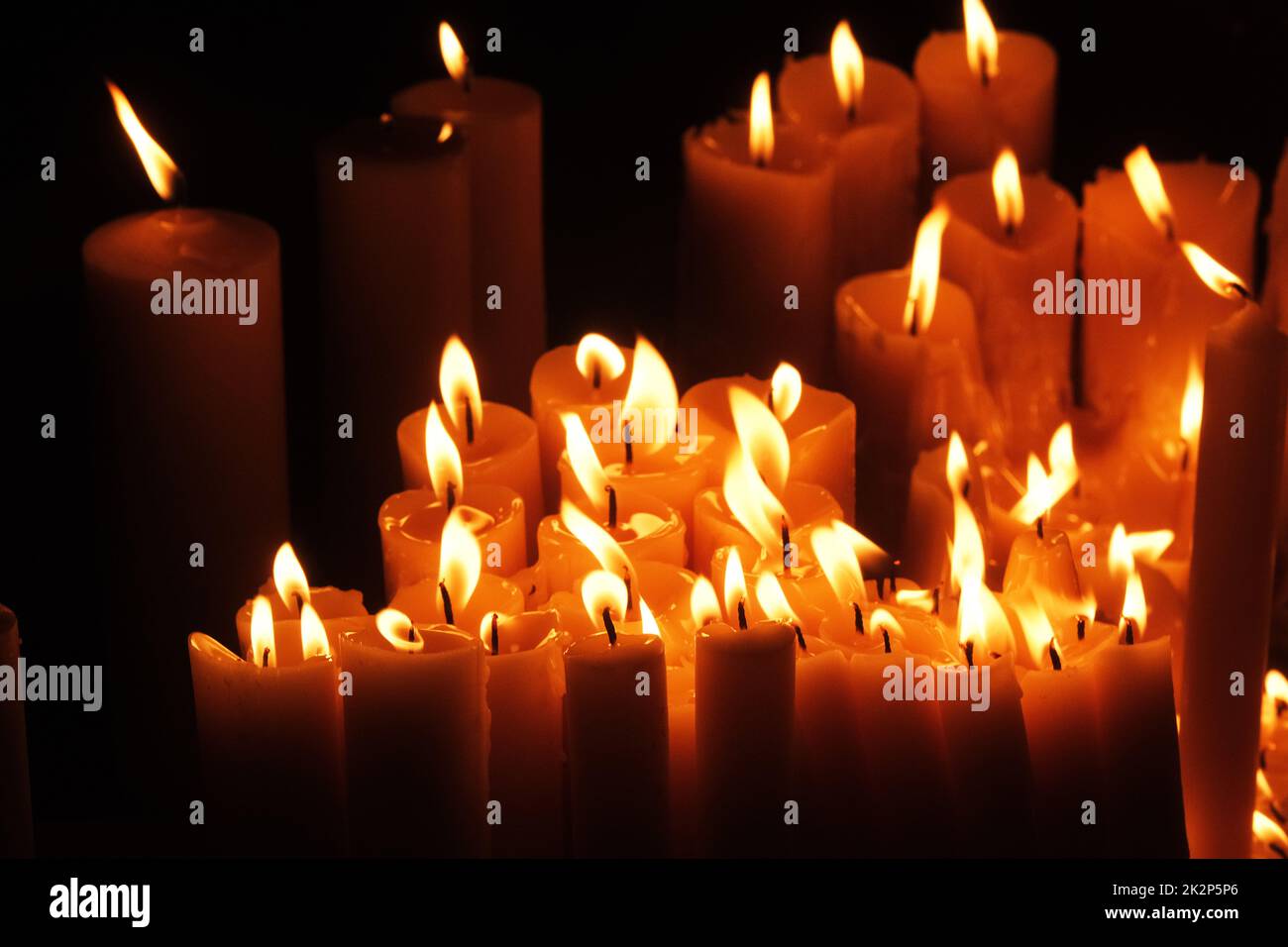 Lighting candles in chapel of Our Lady from the Kamenita vrata (Stone