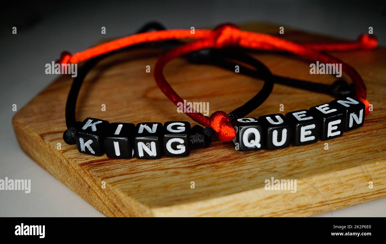 Alphabet initials bracelet with king and queen names Stock Photo
