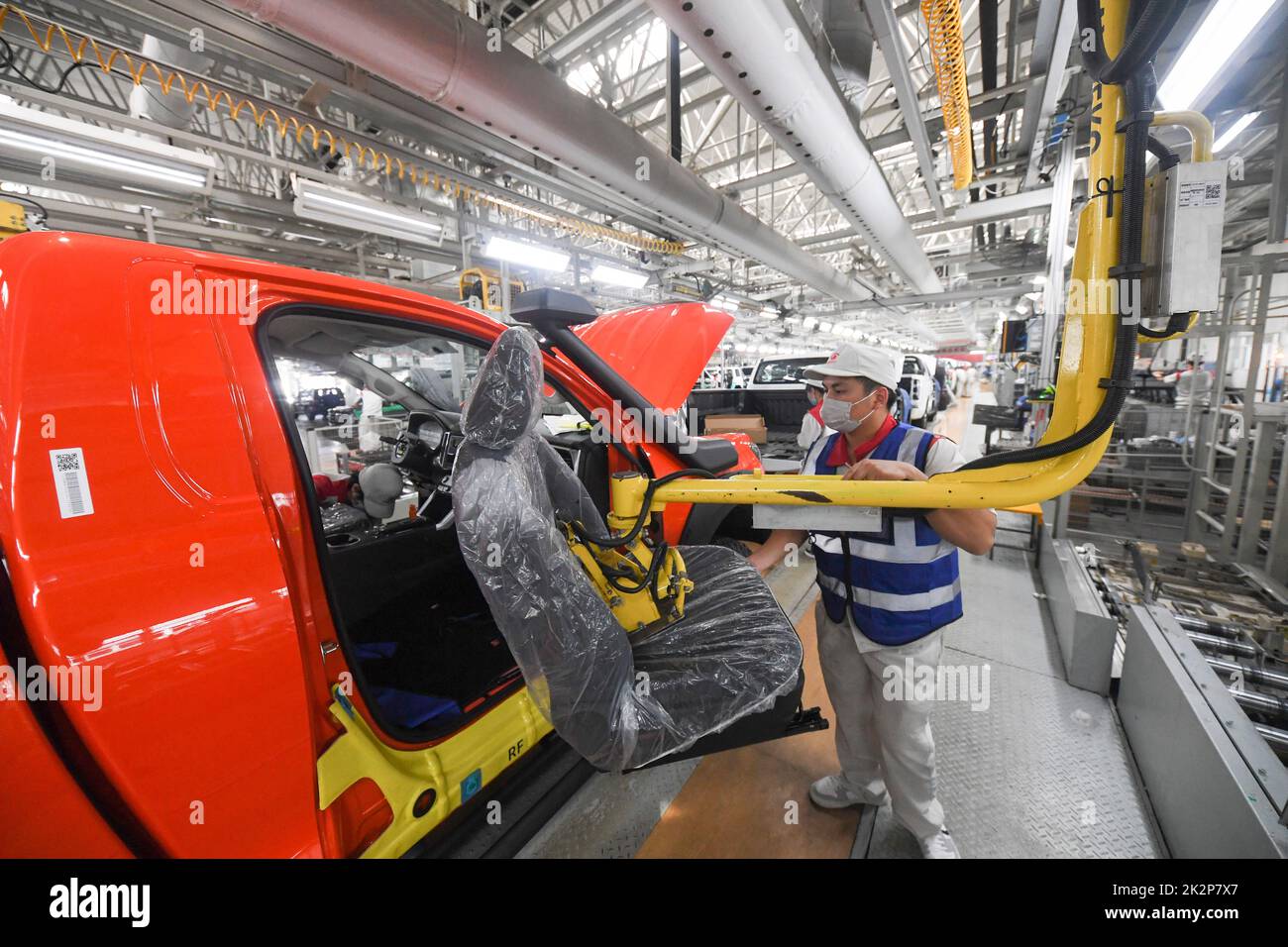 Chongqing, China. 22nd Sep, 2022. Workers work at an intelligent production base of the Great Wall Motors (GWM) in Yongchuan District of Chongqing, southwest China, Sept. 22, 2022. In recent years, Yongchuan District of Chongqing has focused on the development of smart manufacturing which features integrated industrial Internet, big data, artificial intelligence. Smart manufacturing has now become a new growth driver for the local economy. Credit: Wang Quanchao/Xinhua/Alamy Live News Stock Photo