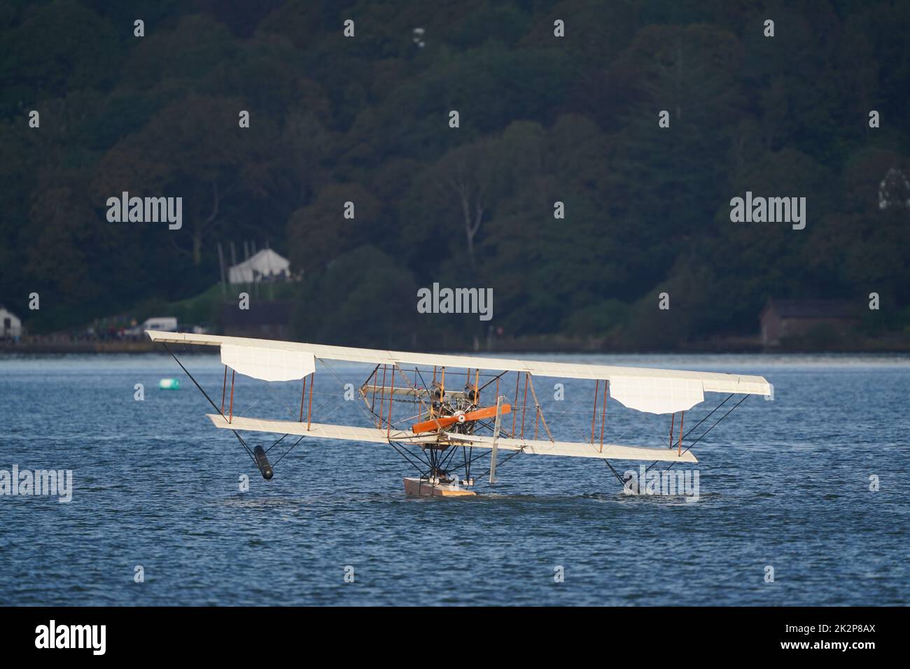 A replica of Waterbird, the UK's first successful seaplane and the only one its kind in the world, during its first public flight on Lake Windermere in Cumbria. The event marks the climax of a 13-year project to create an exact copy of the Waterbird and apart from a modern engine, it faithfully recreates the detail of the original from 1911 seaplane. Picture date: Friday September 23, 2022. The replica has been constructed from wood, bamboo and wires, the same materials used to construct the original seaplane. The 35ft long aircraft, has a wingspan of 40ft and weighs just 1000lb. It is powered Stock Photo