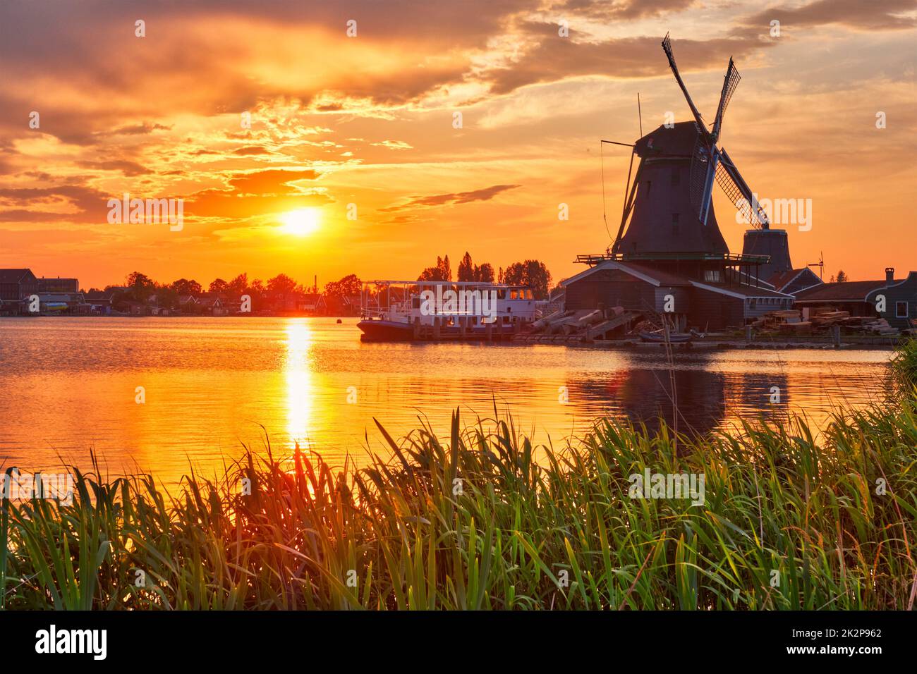 Windmills at Zaanse Schans in Holland on sunset. Zaandam, Nether Stock