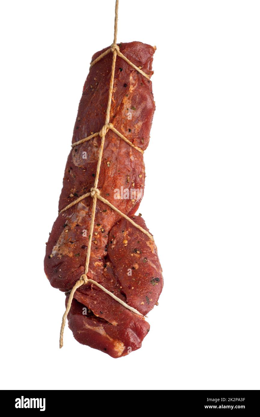hanging raw pork fillet Stock Photo Alamy