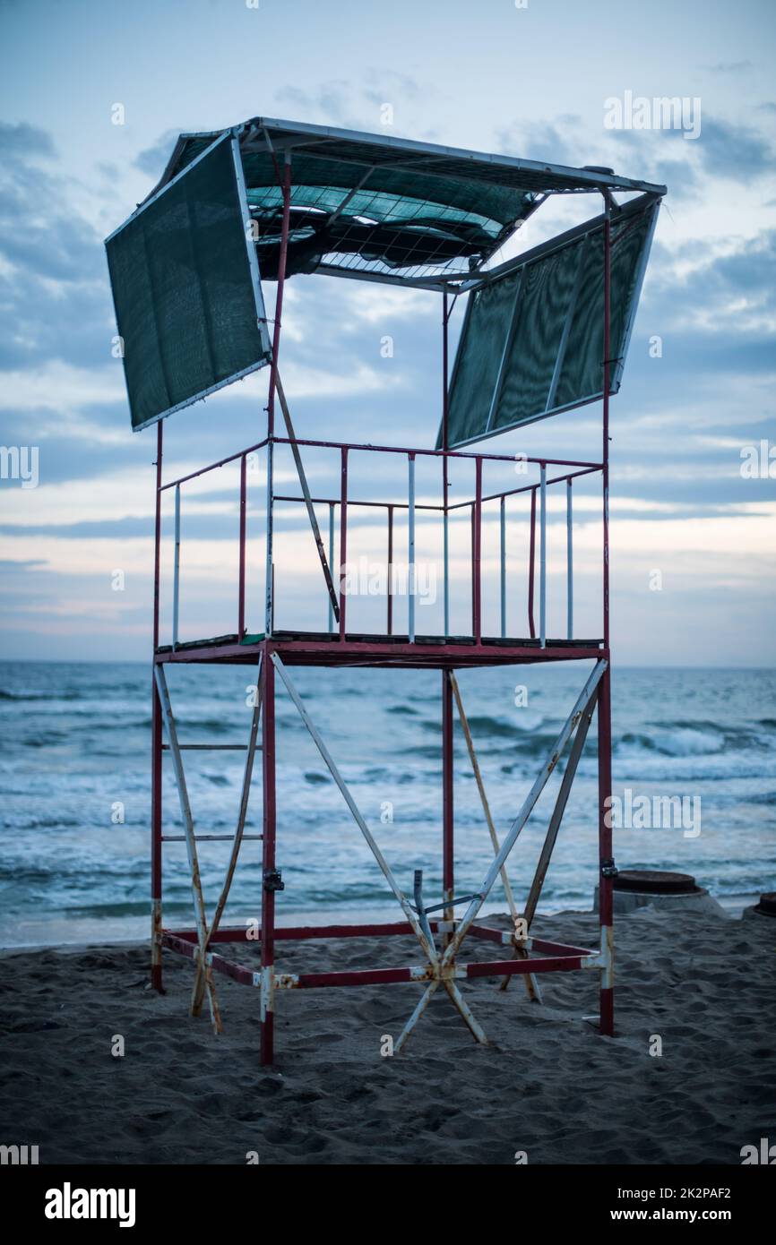 An abandoned lifeguard station by the sea shore. Stock Photo