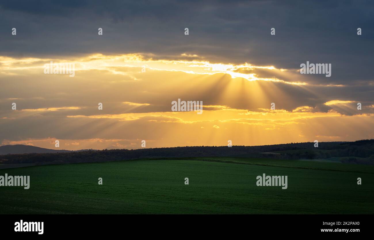 Sun rays on a gap in the clouds in Burgenland Stock Photo
