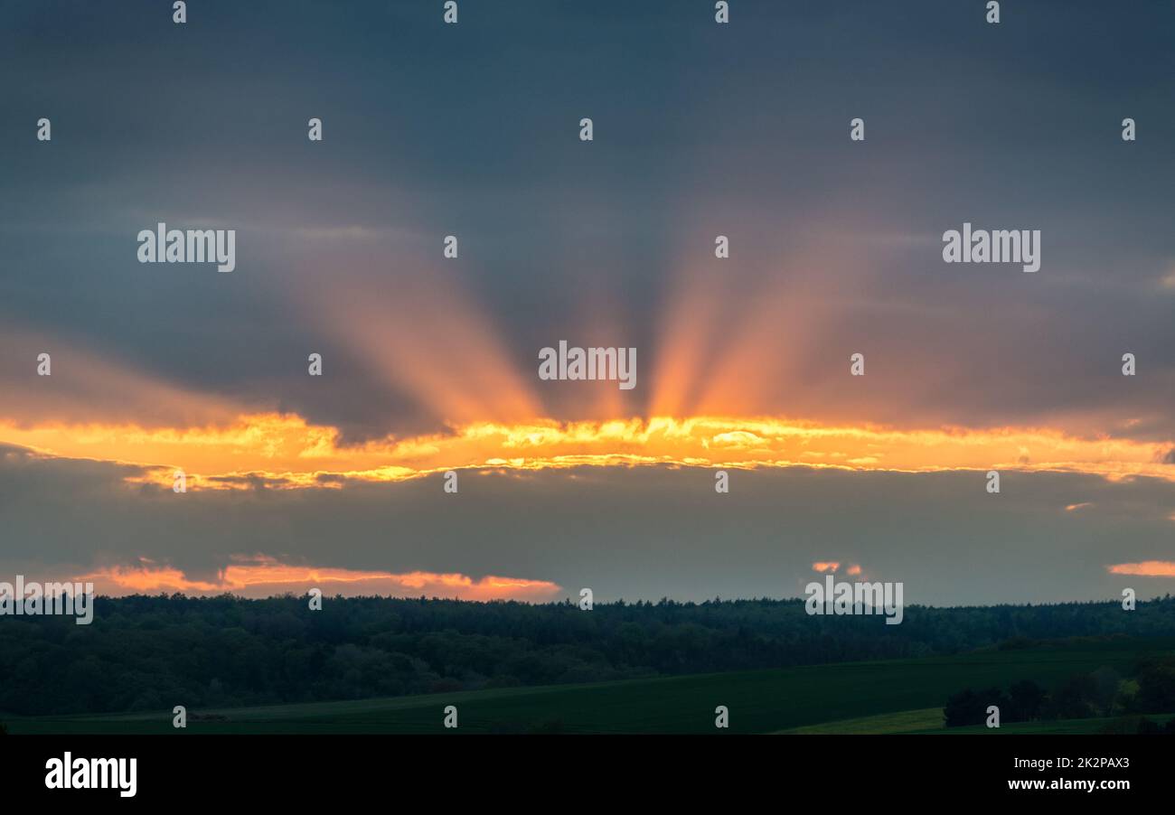 Sun rays on a gap in the clouds in Burgenland Stock Photo