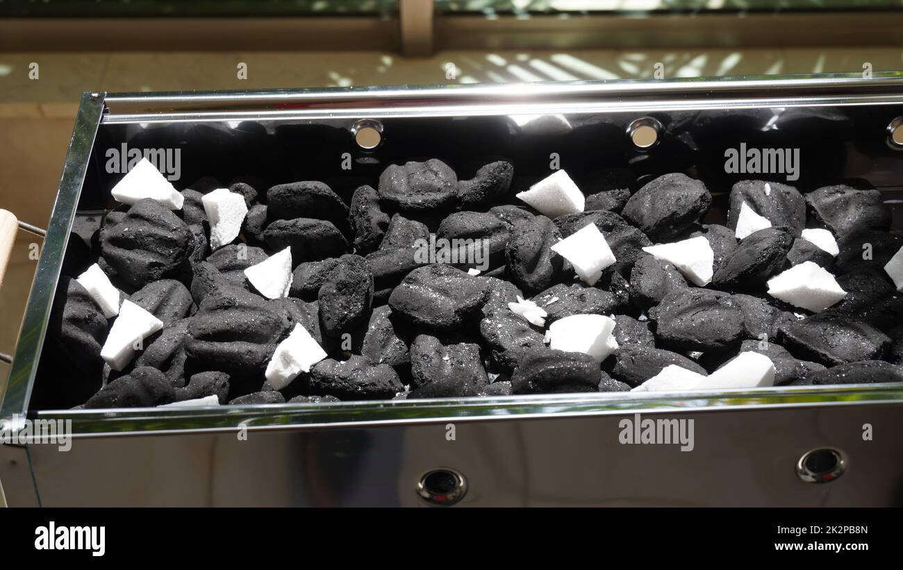 Charcoal and firelighters ready for Barbecue Fire in Mangal (middle