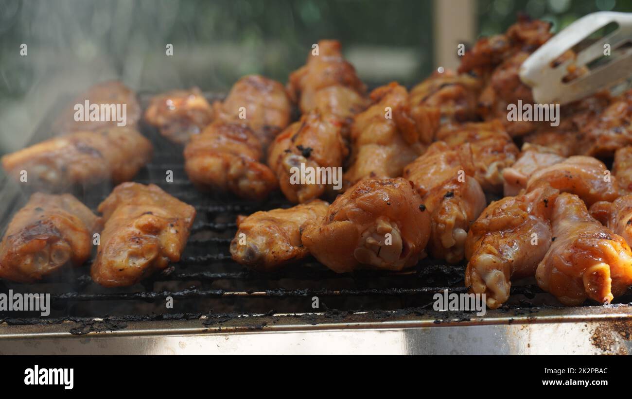 Fresh chicken steak grill meat on fire. Making barbecue on the grill Stock Photo