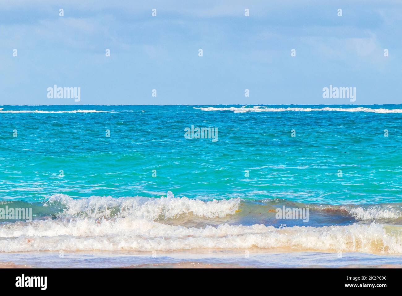 Waves water caribbean coast and beach panorama view Tulum Mexico. Stock Photo