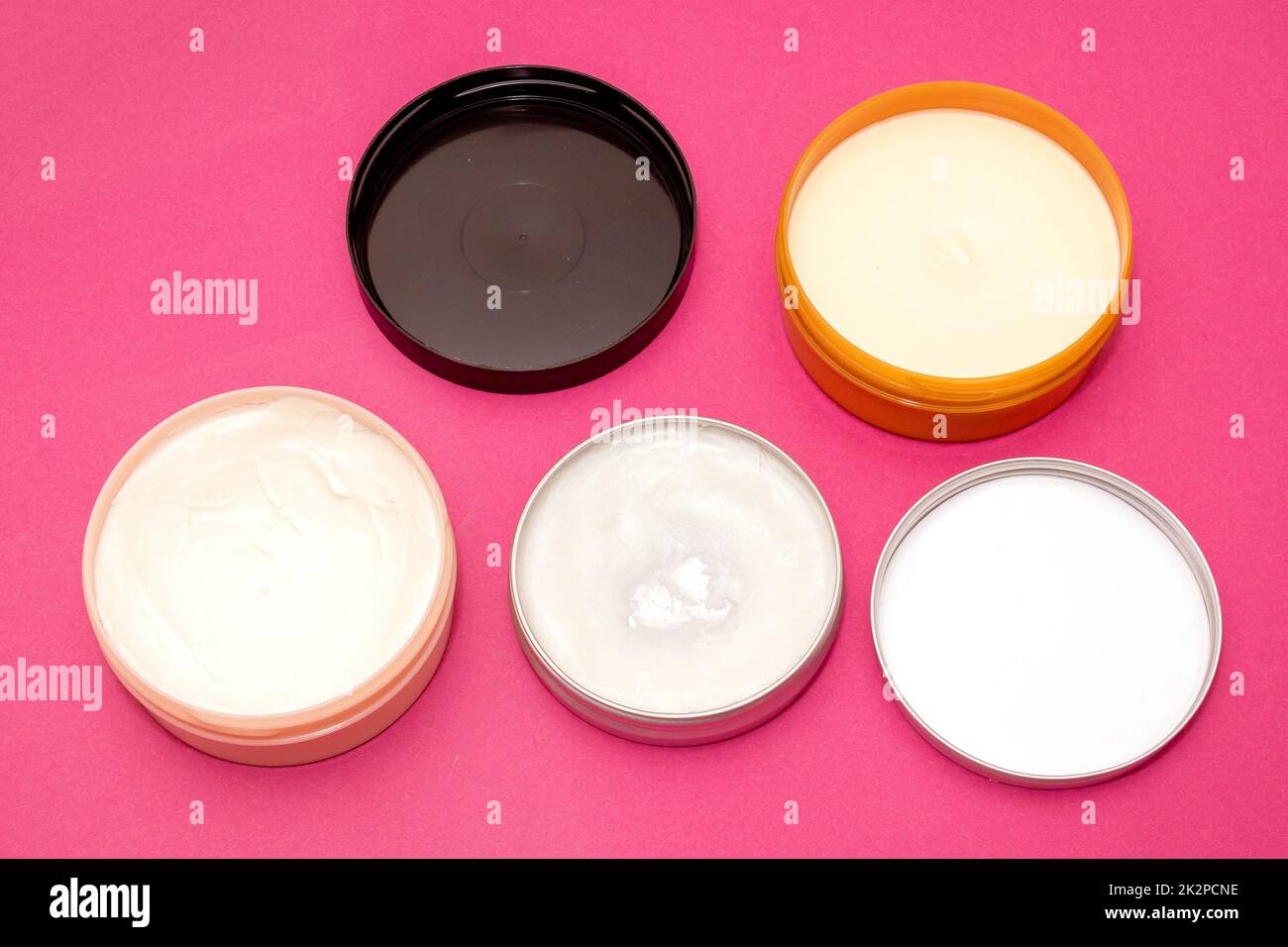 Open body butter containers Stock Photo Alamy